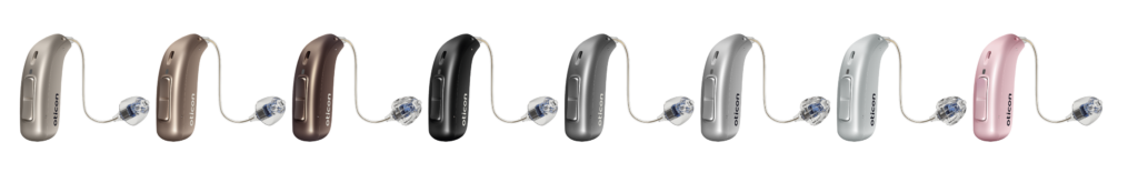8 Oticon More Hearing aids in a row in different colors